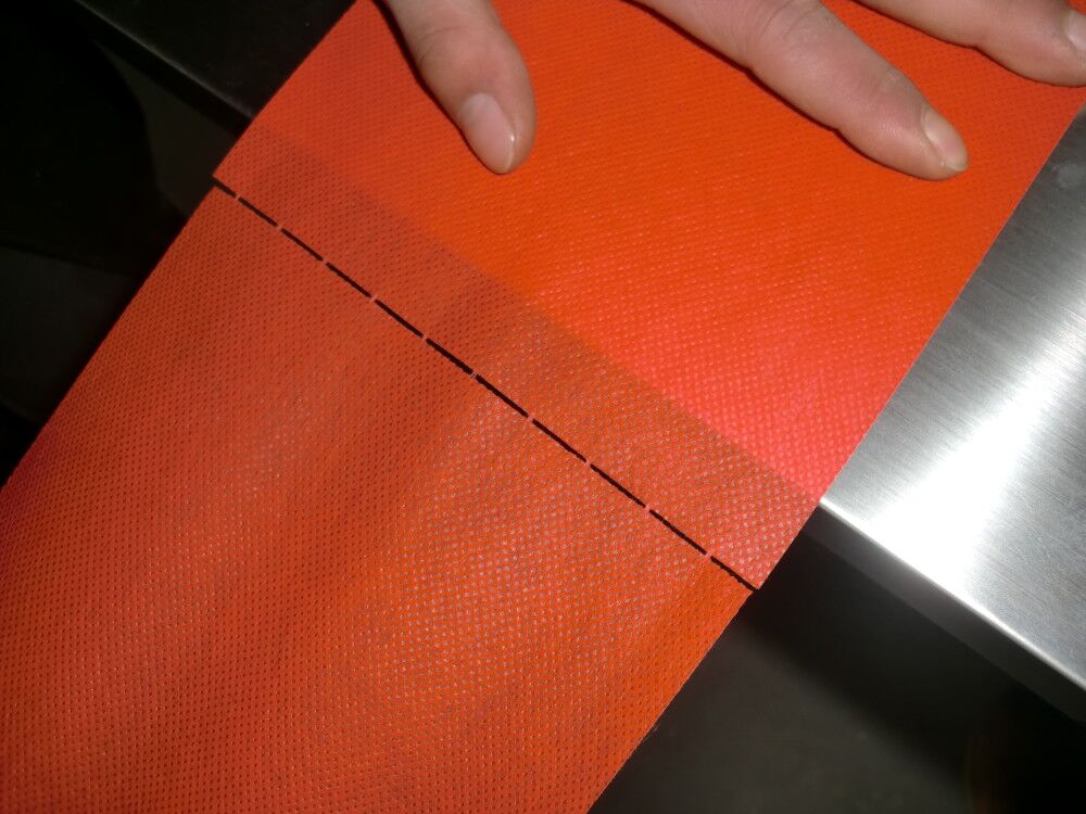 PERFORATED NONWWOVEN LAMINATED         FABRIC Photo 01 AAAAA.jpg